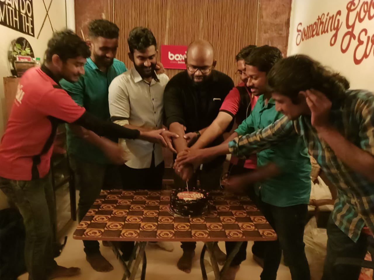 Boxall founders and team cutting a cake to celebrate a milestone in 2022