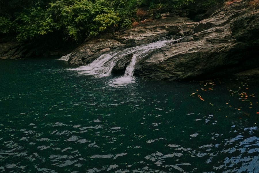 One of the Thommankuthu falls dropping into a deep pool below